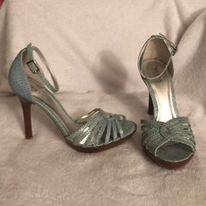 Aqua pebbled leather heels by Guess